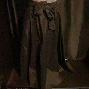 Black satin looking skirt with tie around belt.